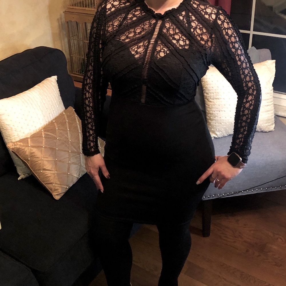Black long sleeve dress, back is see trough
